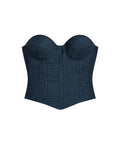 Navy blue strapless top with geometric pattern on a beige background