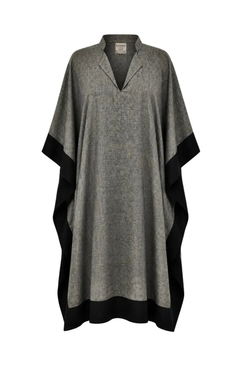 Gray poncho with black trim on a white background